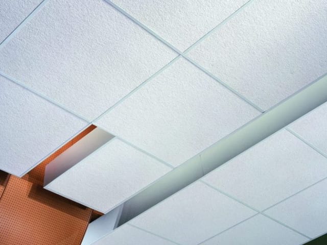 Acoustic ceiling tile set into suspended grid